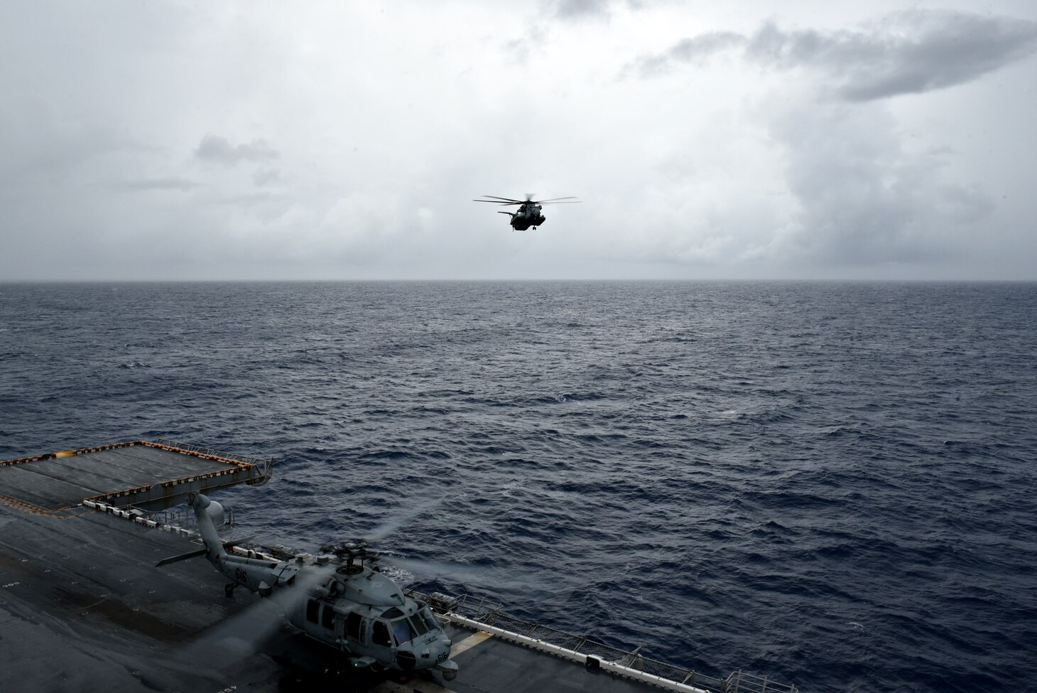 PACIFIC OCEAN (Sept. 11, 2018) - A CH-53E Super Stallion helicopter, assigned to the 31st Marine Expeditionary Unit (31st MEU) approaches the amphibious assault ship USS Wasp (LHD 1). Sailors and Marines from Wasp Expeditionary Strike Group, 31st Marine Expeditionary Unit team are providing Department of Defense support to the Federal Emergency Management Agency and working with Guam and Commonwealth of the Northern Marianas'  civil and local officials for Typhoon Mangkhut recovery efforts.