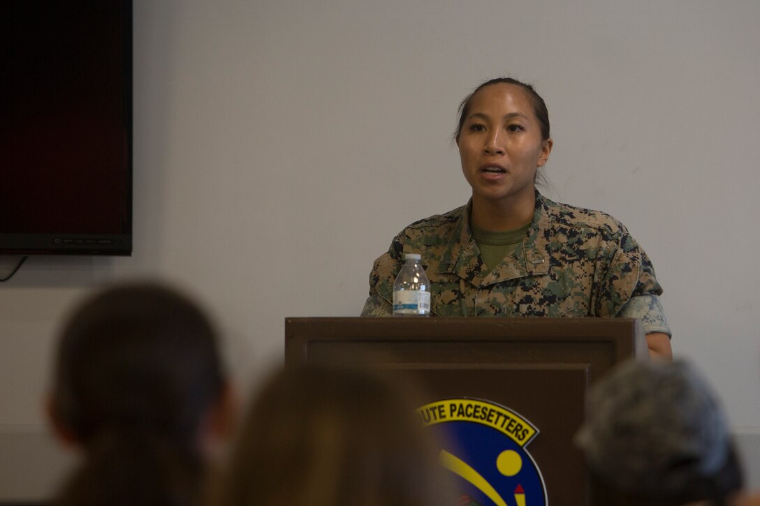 KADENA AIR BASE, OKINAWA, Japan – 1st Lt. Amanda Henegar speaks to volunteers during a noncombatant evacuation operations training exercise Aug. 6 at the Samurai Terminal on Kadena Air Base, Okinawa, Japan.