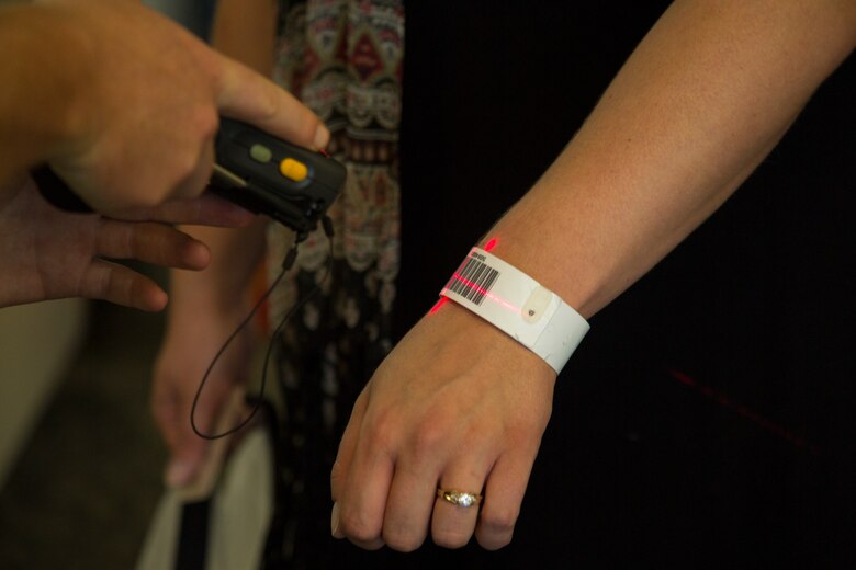 MARINE CORPS AIR STATION FUTENMA, OKINAWA, Japan – An identification wrist band is scanned during a noncombatant evacuation operations training exercise Aug. 6 at the Samurai Terminal on Kadena Air Base, Okinawa, Japan.