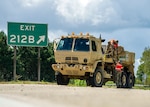 South Carolina Army National Guard Soldiers from the 118th Forward Support Company stage recovery equipment to provide support for disabled vehicles during the lane reversal of I-26 in North Charleston, South Carolina, Sept. 11, 2018.  Approximately 2,000 Soldiers and Airmen have been mobilized to prepare, respond and participate in recovery efforts as forecasters project Hurricane Florence will increase in strength with potential to be a Category 4 storm and a projected path to make landfall near the Carolinas and East Coast.