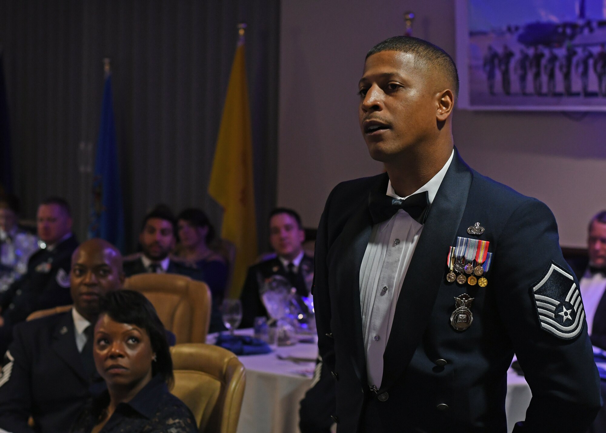 A member of the 94th Security Forces Squadron asks guest speaker, Col. Wayne Waddell, U.S. Air Force retired, a question at the Air Force Ball hosted by the 94th Airlift Wing at Dobbins Air Reserve Base, Sept. 8, 2018. Waddell spent six years as a prisoner of war in Vietnam, and spoke about how he was shot down and captured. (U.S. Air Force Photo by Staff Sgt. Miles Wilson)