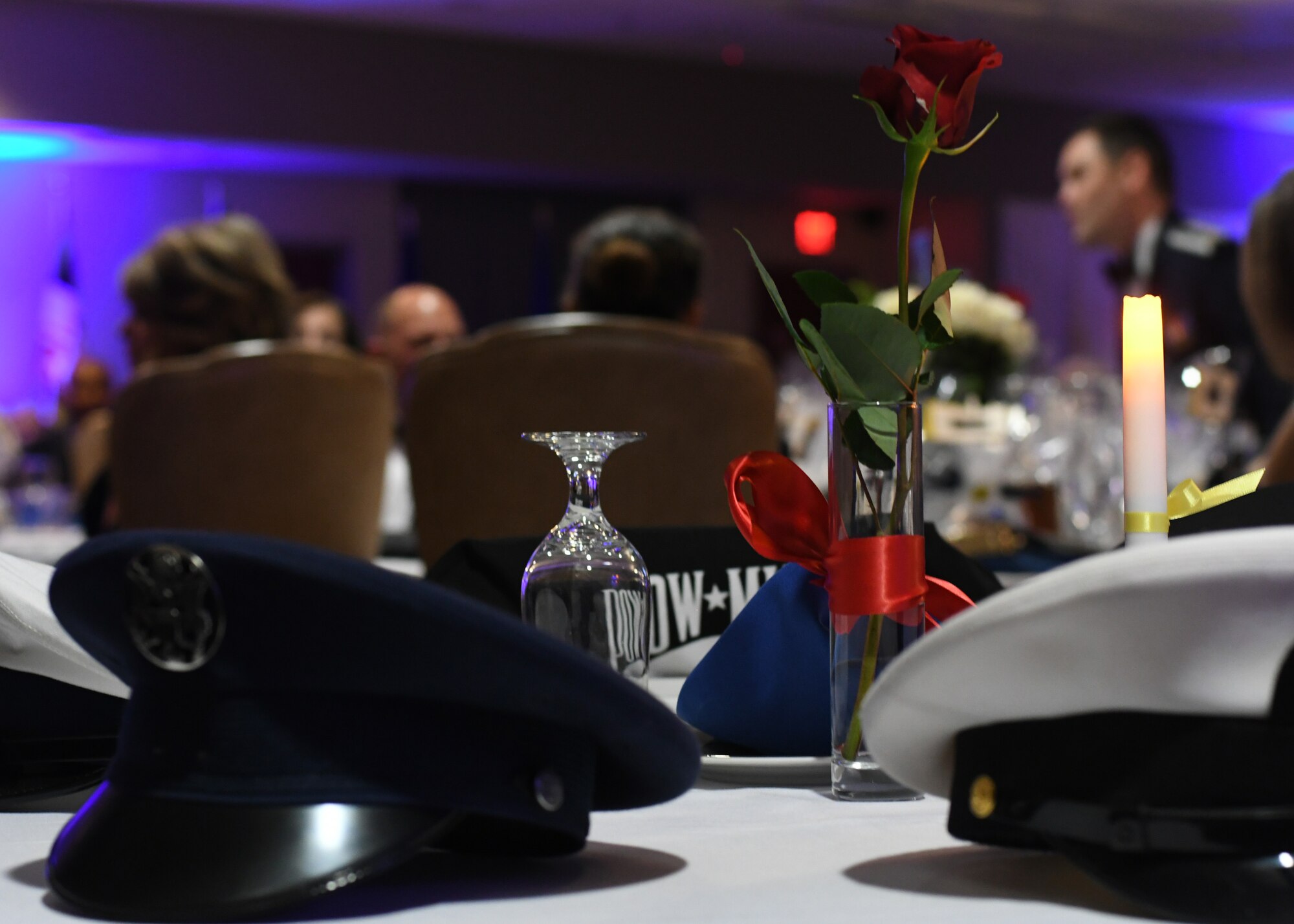 A prisoner of war and missing in action memorial table was placed during an Air Force Ball hosted by the 94th Airlift Wing at Dobbins Air Reserve Base, Ga, Sept. 8, 2018. During the ball, guest speaker Col. Wayne Waddell, United States Air Force retired, talked about his time as a prisoner of war in Vietnam, and allowed the attendees to ask questions about his imprisonment. (U.S. Air Force Photo by Staff Sgt. Miles Wilson)