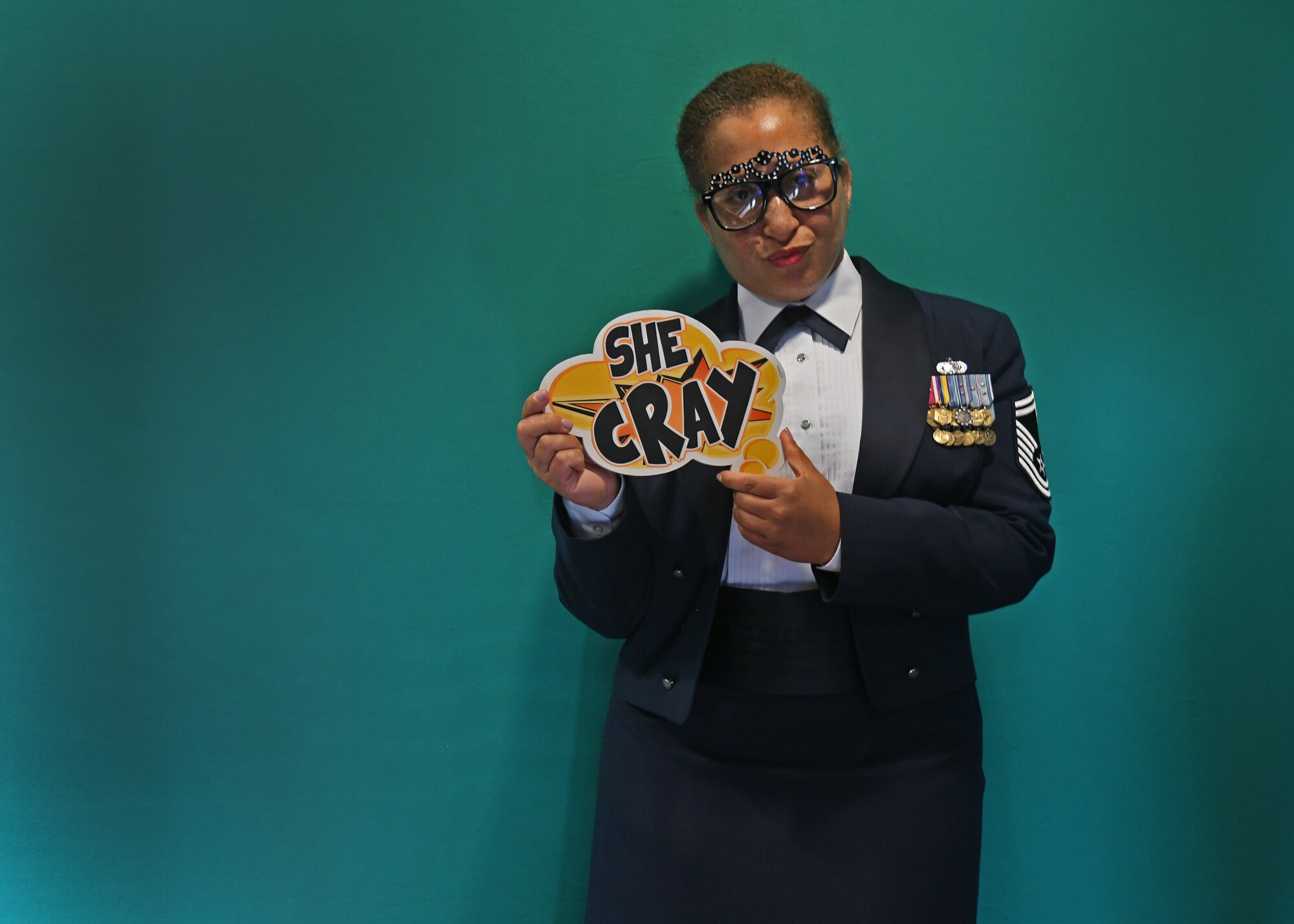 Senior Master Sgt. Lena Tamplin, 94th Airlift Wing yellow ribbon representative, poses for a photo at Dobbins Air Reserve Base, Ga, Sept. 8, 2018. Tamplin took photos while attending an Air Force Ball hosted by the 94th Airlift Wing, commemorating the Air Force's 71st birthday. During the ball, guest speaker Col. Wayne Waddell, United States Air Force retired, spoke about his experiences as a prisoner of war in vietnam. (U.S. Air Force Photo by Staff Sgt. Miles Wilson)