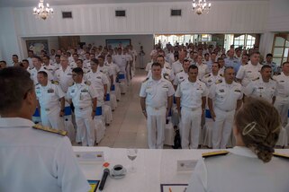 Multinational sailors stand for the Colombian national anthem during the closing ceremony of UNITAS 2018