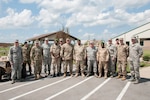 Service members from the Niger Armed Forces and Indiana National Guard pose for a group photo at the conclusion of a State Partnership Program meeting at Hulman Field Air National Guard Base, Terre Haute, Indiana, Aug. 28, 2018.