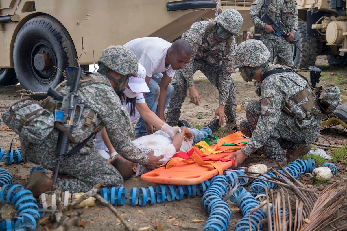 Colombian marines treat a simulated casualty during a humanitarian assistance training exercise for UNITAS 2018.