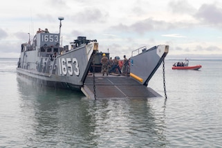 A landing craft utility attached to Beachmaster Unit 2 prepares to land on the beach in Cartagena, Colombia for a humanitarian assistance training exercise.