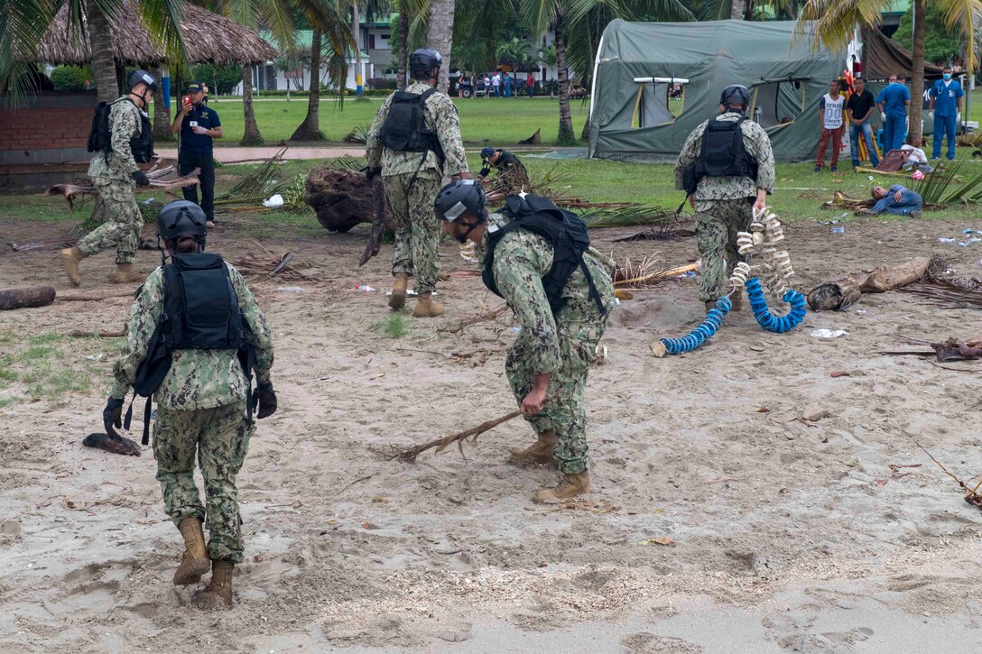 Sailors prepare a beach for landing in Cartagena, Colombia for a humanitarian assistance training exercise.