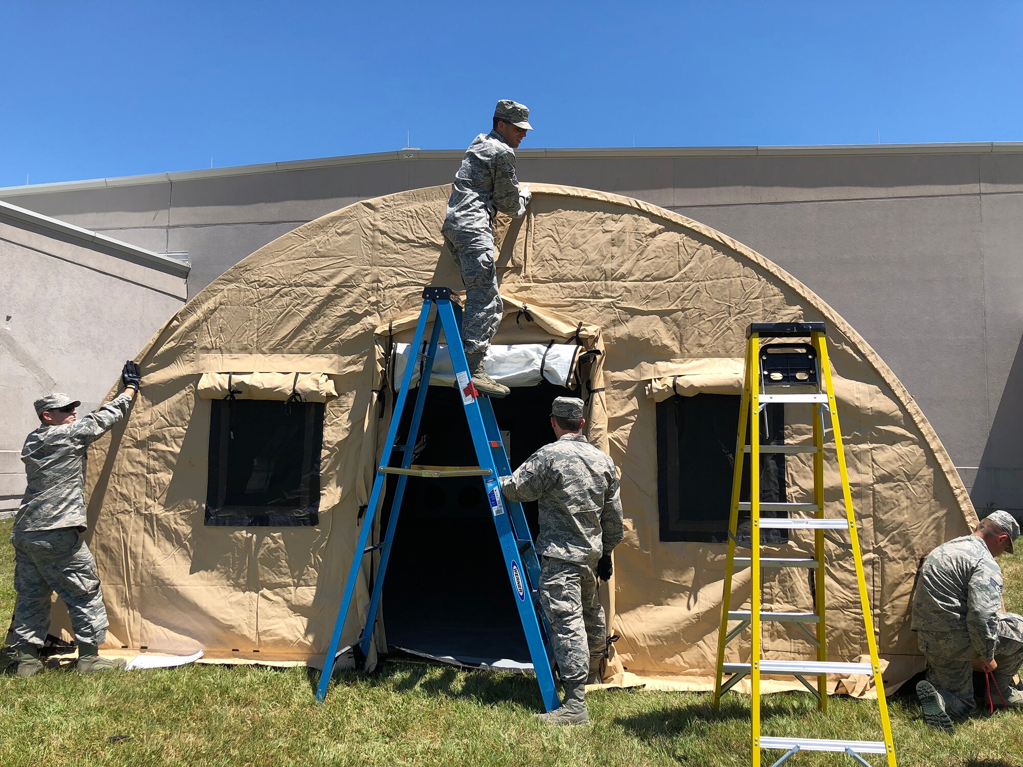Airmen from the 445th Aeromedical Staging Squadron set up an En Route Patient Staging Shelter outside their squadron July 17, 2018. The shelter is used for temporary staging, casualty care and administration support during contingency operations and can hold up to 50 patients.