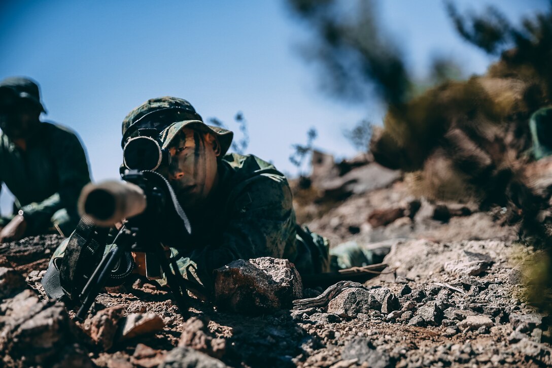 A Singapore Guardsman provides sniper support for a ground assault on Range 400 during Valiant Mark 2018 aboard the Marine Corps Air Ground Combat Center, Twentynine Palms, Calif., Sept. 5, 2018. Valiant Mark is an annual exercise conducted by U.S. Marines and the Singapore Armed Forces designed to facilitate increased interoperability and strengthen military-to-military relationships through combined-arms integration skills training. (U.S. Marine Corps photo by Lance Cpl. William Chockey)