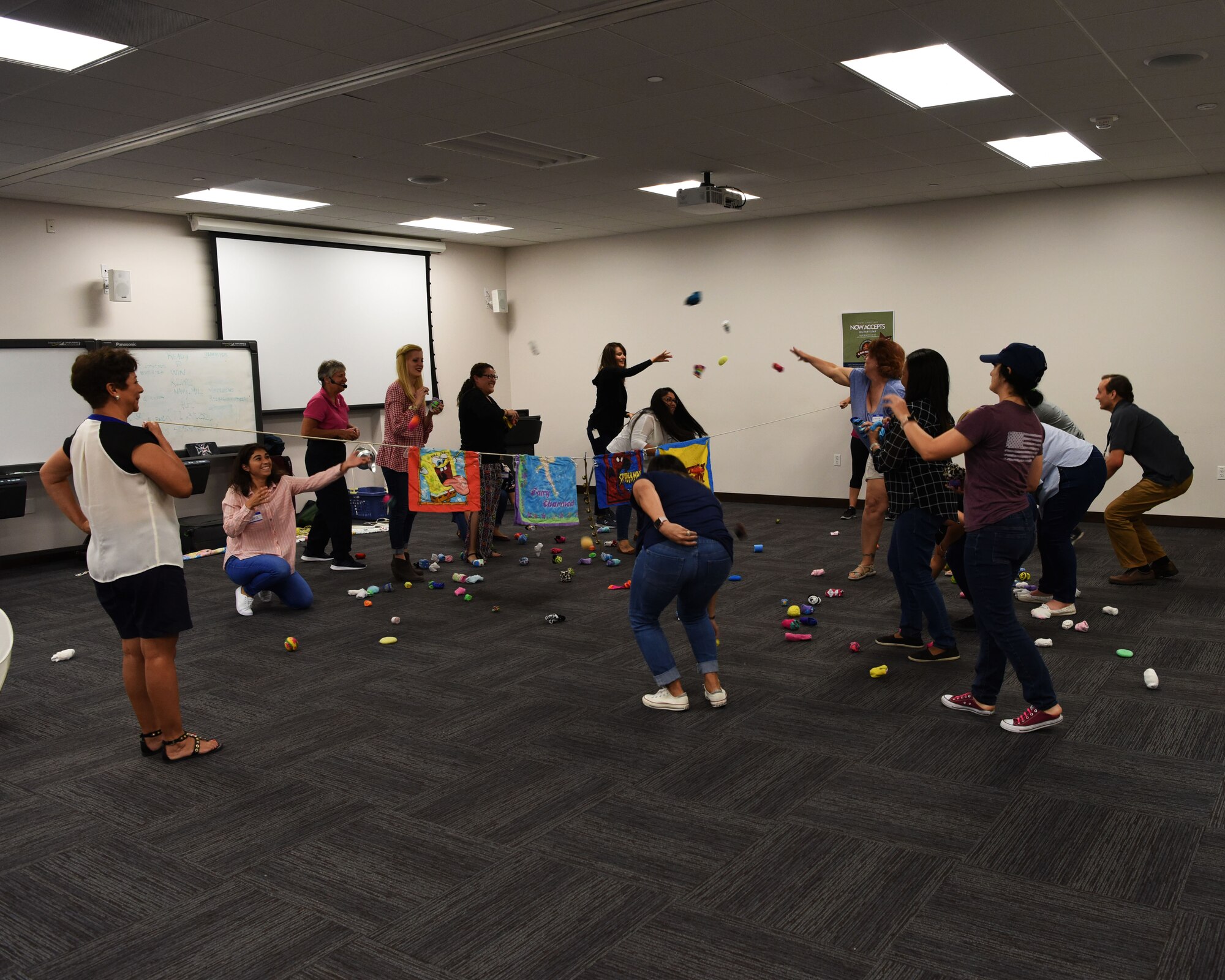 Attendees throw rolled socks during an activity led by Dr. Diane H. Craft, a physical education professor, during a seminar Sept. 5, 2018 at Luke Air Force Base, Ariz.
