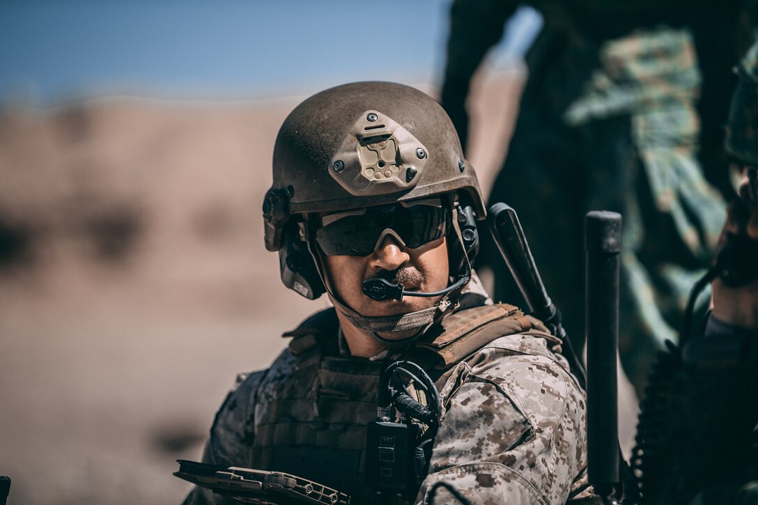 A U.S. Marines with 3rd Battalion, 4th Marines coordinates airstrikes during Valiant Mark 2018 at the Marine Corps Air Ground Combat Center, Twentynine Palms, Calif., Aug. 5, 2018. Valiant Mark is an annual exercise conducted by U.S. Marines and the Singapore Armed Forces designed to facilitate increased interoperability and strengthen military-to-military relationships through combined-arms integration skills training. (U.S. Marine Corps photo by Lance Cpl. William Chockey)