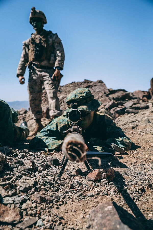 A Singapore Guardsman and a U.S. Marine with 2nd Battalion, 7th Marine Regiment provide sniper support on Range 400 during Valiant Mark 2018 aboard the Marine Corps Air Ground Combat Center, Twentynine Palms, Calif., Sept. 5, 2018. Valiant Mark is an annual exercise conducted by U.S. Marines and the Singapore Armed Forces designed to facilitate increased interoperability and strengthen military-to-military relationships through combined-arms integration skills training. (U.S. Marine Corps photo by Lance Cpl. William Chockey)