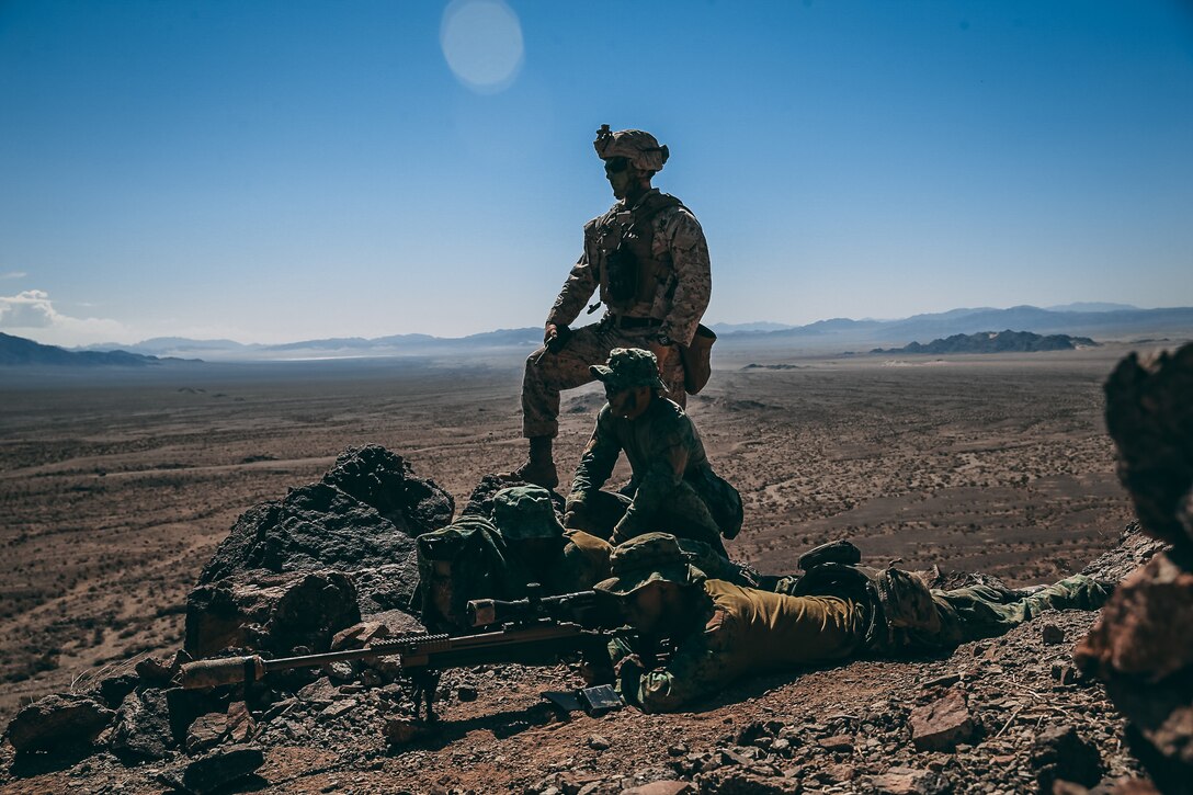 Singapore Guardsmen and a U.S. Marine with 2nd Battalion, 7th Marine Regiment provide sniper support on Range 400 during Valiant Mark 2018 aboard the Marine Corps Air Ground Combat Center, Twentynine Palms, Calif., Sept. 5, 2018. Valiant Mark is an annual exercise conducted by U.S. Marines and the Singapore Armed Forces designed to facilitate increased interoperability and strengthen military-to-military relationships through combined-arms integration skills training. (U.S. Marine Corps photo by Lance Cpl. William Chockey)