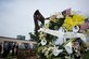 A wreath of yellow flowers stands in front of the Joint Base McGuire-Dix-Lakehurst 9/11 Memorial following a commemorative ceremony at the Timmermann Center on JB MDL, N.J., Sept. 11, 2018. The memorial site contains twisted steel beams that were salvaged from ground zero, and was officially completed in 2016.