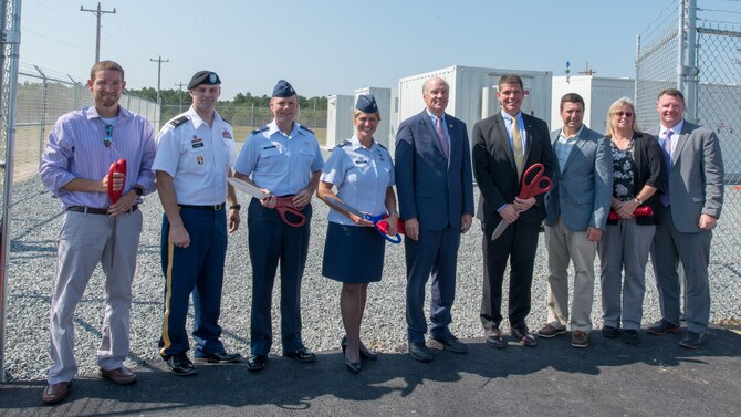 Leaders of the Otis Microgrid project pose for a photo following the ribbon cutting ceremony.