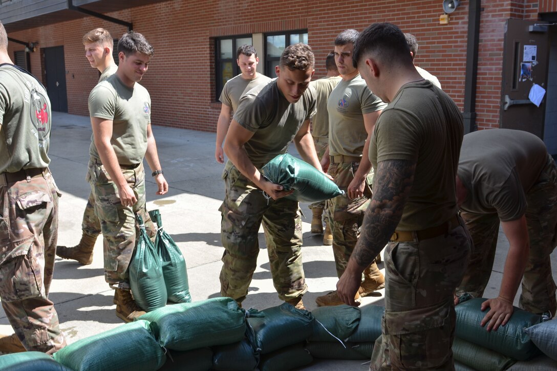 Soldiers stack sandbags at Fort Bragg, N.C.