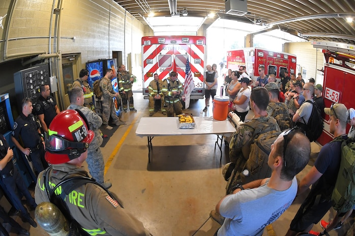 Staff Sgt. Caleb Saunders, 775 Civil Engineering Squadron, reads aloud a short story from a 9/11 first responder survivor, Sept. 11, 2018. Military and local first responders came together to pay tribute and remember those who have given the ultimate sacrifice by participating in the annual 9/11 terrorist attacks Memorial Ruck March. The march started in Kaysville and ended at Hill Air Force Base South Gate, a total of 9.11 miles.