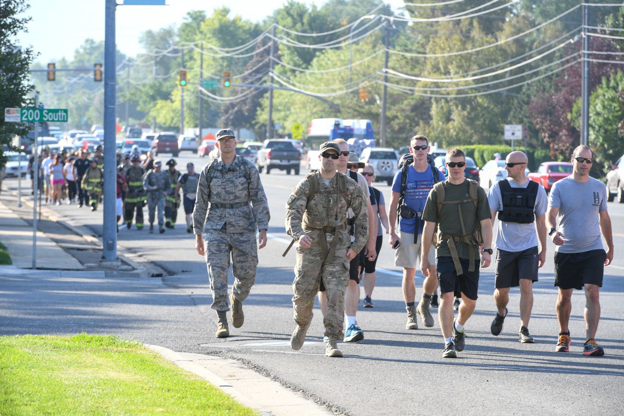 Members from Hill Air Force Base's 775th Civil Engineering Squadron alongside members of Kaysville and Layton fire and police departments, walk together during the 9/11 Memorial Ruck March, commemorating the Sept. 11 terrorist attacks. This is Hill's 3rd annual ruck march and the first teaming up with first responders from local communities. The march started in Kaysville and ended at Hill Air Force Base South Gate, a total of 9.11 miles.