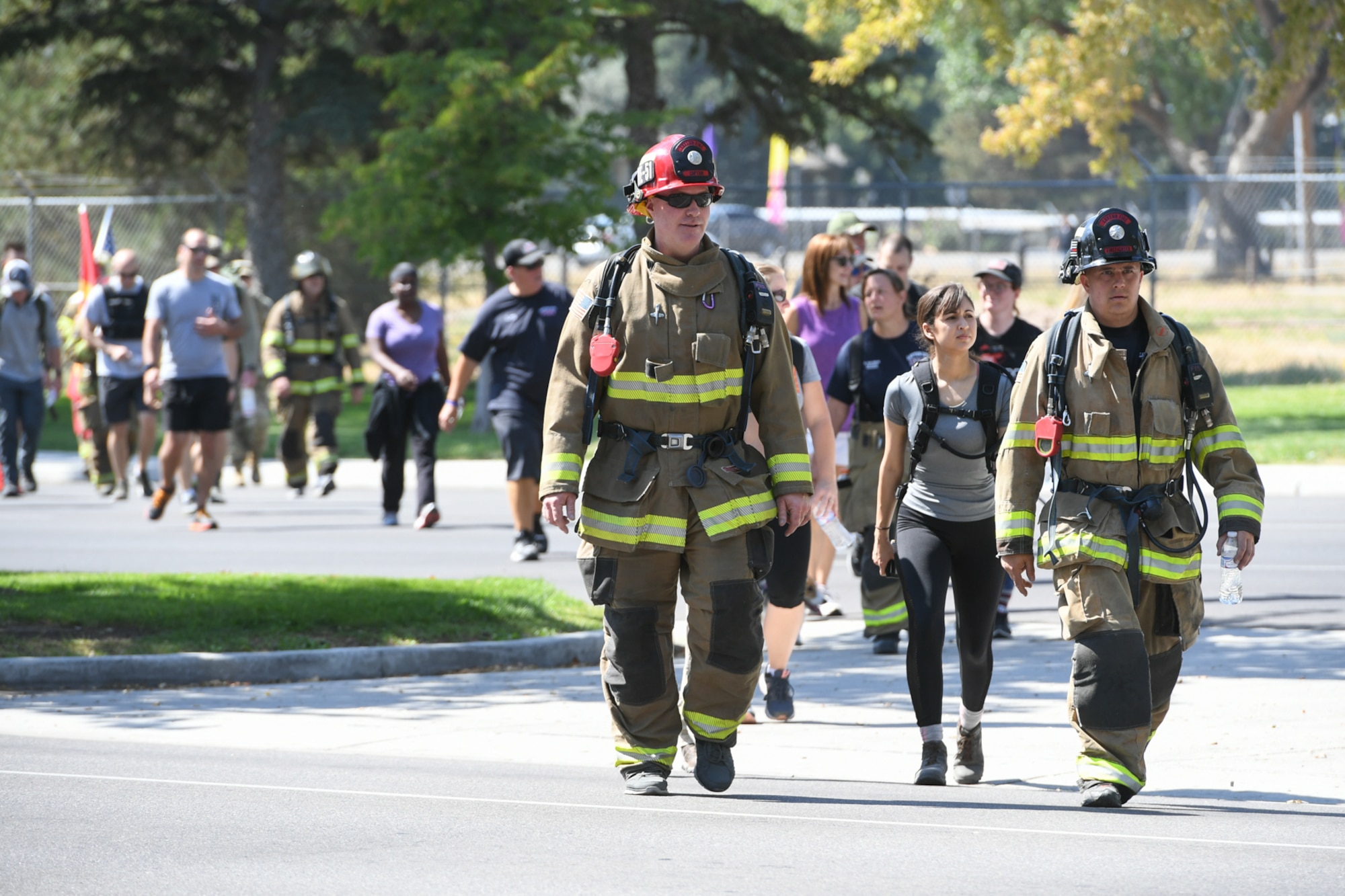 Members from Hill Air Force Base's 775th Civil Engineering Squadron alongside members of Kaysville and Layton fire and police departments, walk together during the 9/11 Memorial Ruck March, commemorating the Sept. 11 terrorist attacks. This is Hill's 3rd annual ruck march and the first teaming up with first responders from local communities. The march started in Kaysville and ended at Hill Air Force Base South Gate, a total of 9.11 miles.