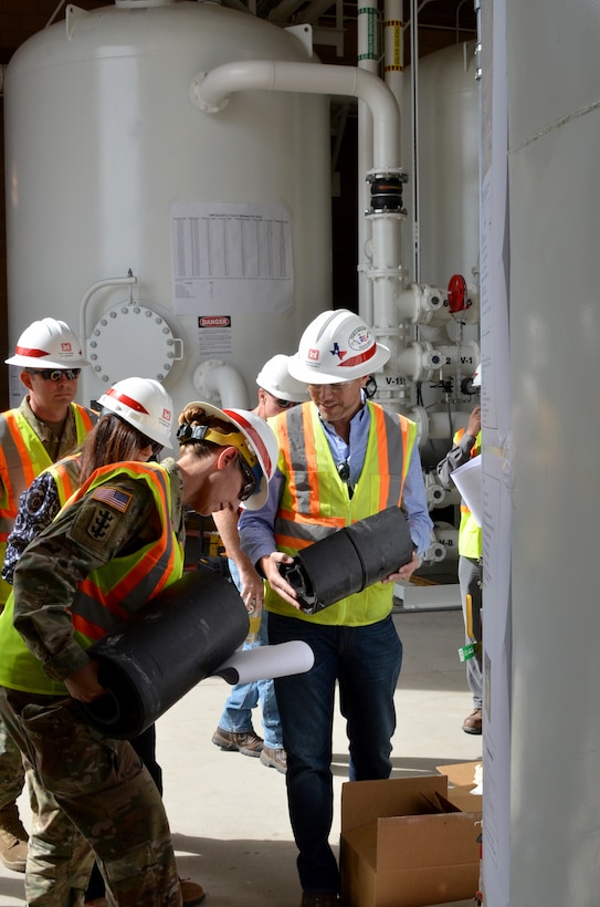 KIRTLAND AIR FORCE BASE, N.M. – Mark Phaneuf, right, geologist in the District’s Environmental Engineering Section, discusses the Bulk Fuels Facility Remediation Project with South Pacific Division commander Col. Kimberly Colloton (front left); Linda Dreeland, (2nd from left), chief, Environmental and SRM Section; and District commander Lt. Col. Larry Caswell (left), Aug. 30, 2018.