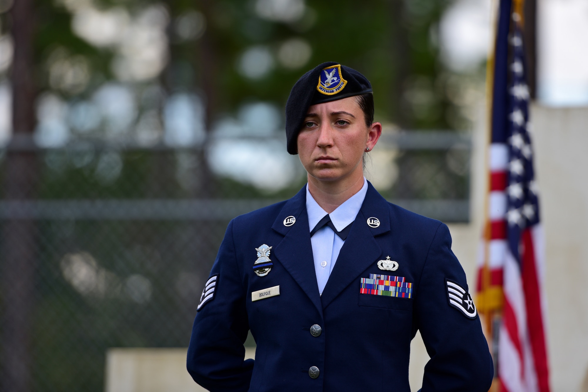 U.S. Air Force Staff Sgt. Caitlin Bourque, 325th Security Forces Squadron military working dog (MWD) handler, stands at parade rest during a memorial service for MWD Jack at Tyndall Air Force Base, Fla., Sept. 7, 2018. Jack, a Belgian Malinois, was an explosives and patrol dog who died after a brief illness. MWDs are afforded military customs and courtesies. (U.S. Air Force photo by Senior Airman Isaiah J. Soliz)