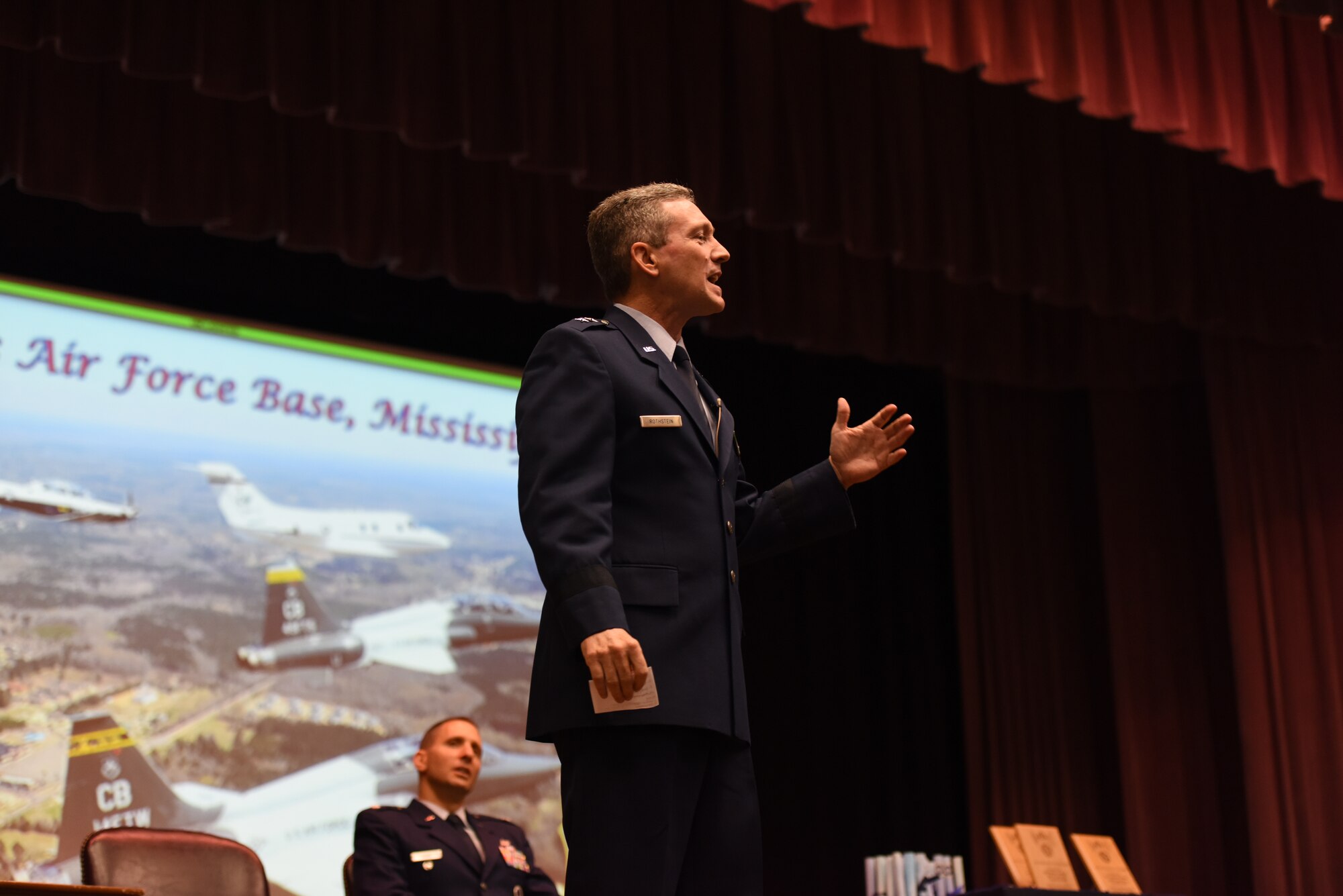 Maj. Gen. Michael D. Rothstein, commander of the Curtis E. LeMay Center and vice commander of Air University at Maxwell Air Force Base, Alabama, speaks at Specialized Undergraduate Pilot Training Classes 18-14/15’s graduation Sept. 7, 2018, on Columbus Air Force Base, Mississippi. In his speech, Rothstein shared his favorite things about being an Air Force pilot. (U.S. Air Force photo by Airman 1st Class Beaux Hebert)