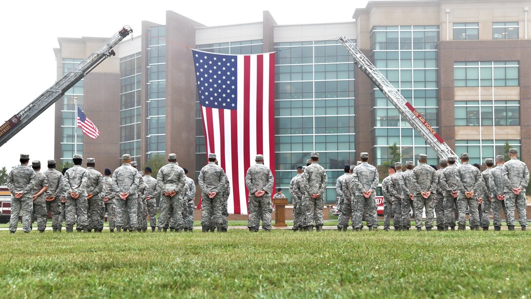 Joint Base Andrews first responders stand in formation during the 9/11 Memorial Service on Joint Base Andrews, Md., Sept. 11, 2018. The formations consisted of four elements to represent the four attacks on Sept. 11, 2001.