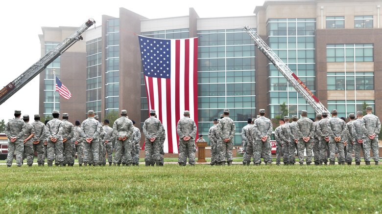 Joint Base Andrews first responders stand in formation during the 9/11 Memorial Service on Joint Base Andrews, Md., Sept. 11, 2018. The formations consisted of four elements to represent the four attacks on Sept. 11, 2001.