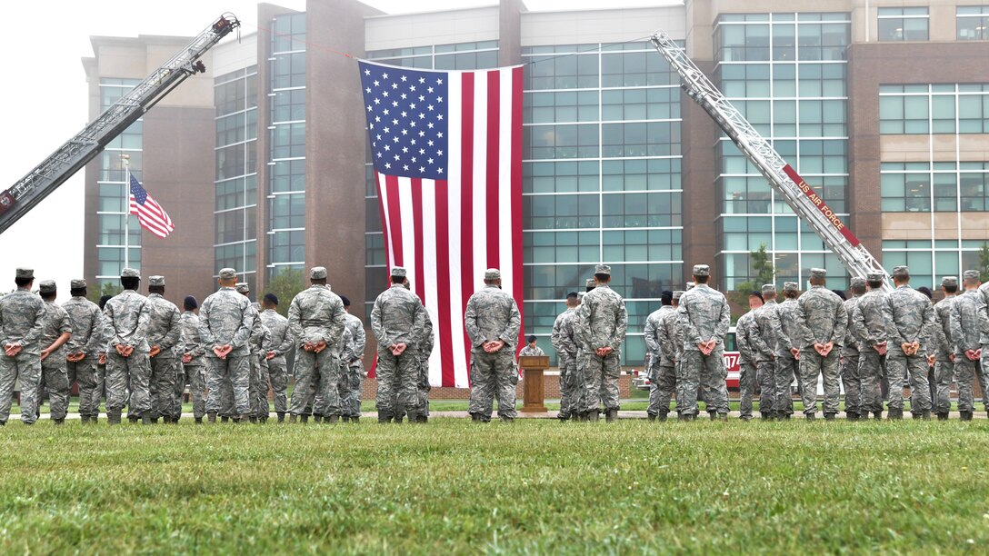 Joint Base Andrews first responders stand in formation during the 9/11 Memorial Service on Joint Base Andrews, Md., Sept. 11, 2018. The formations consisted of four elements to represent the four attacks on Sept. 11, 2001