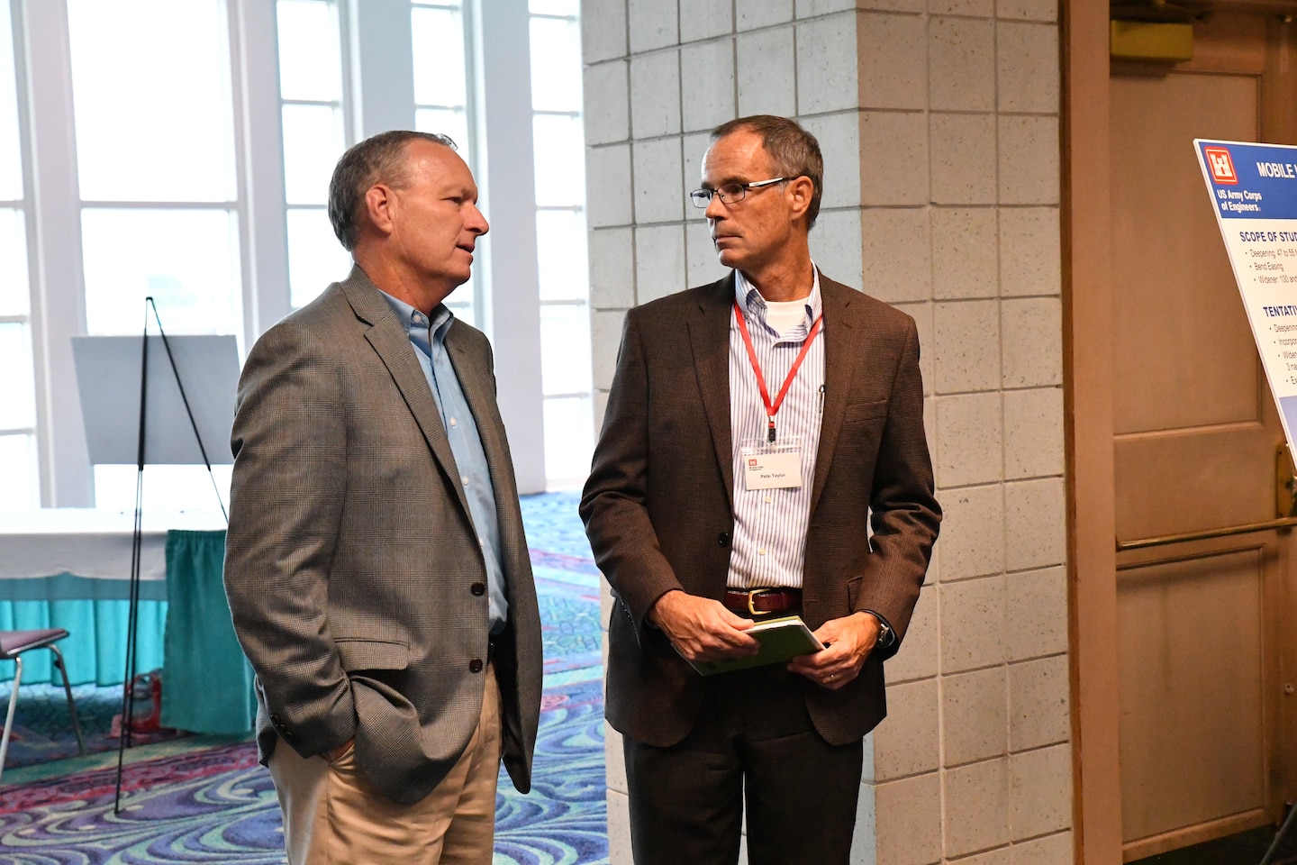 Pete Taylor, Deputy District Engineer of Programs and Project Management with the U.S. Army Corps of Engineers Mobile District, listens to the concerns of a community member at the Open House hosted by the Corps September 11, 2018 at the Mobile Convention Center in Mobile, Ala. The open house was to explain and to receive public comment on the Mobile Harbor Draft General Reevaluation Report with Supplemental Environmental Impact Statement (Draft GRR/SEIS).