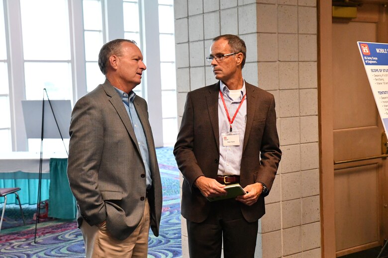 Pete Taylor, Deputy District Engineer of Programs and Project Management with the U.S. Army Corps of Engineers Mobile District, listens to the concerns of a community member at the Open House hosted by the Corps September 11, 2018 at the Mobile Convention Center in Mobile, Ala. The open house was to explain and to receive public comment on the Mobile Harbor Draft General Reevaluation Report with Supplemental Environmental Impact Statement (Draft GRR/SEIS).