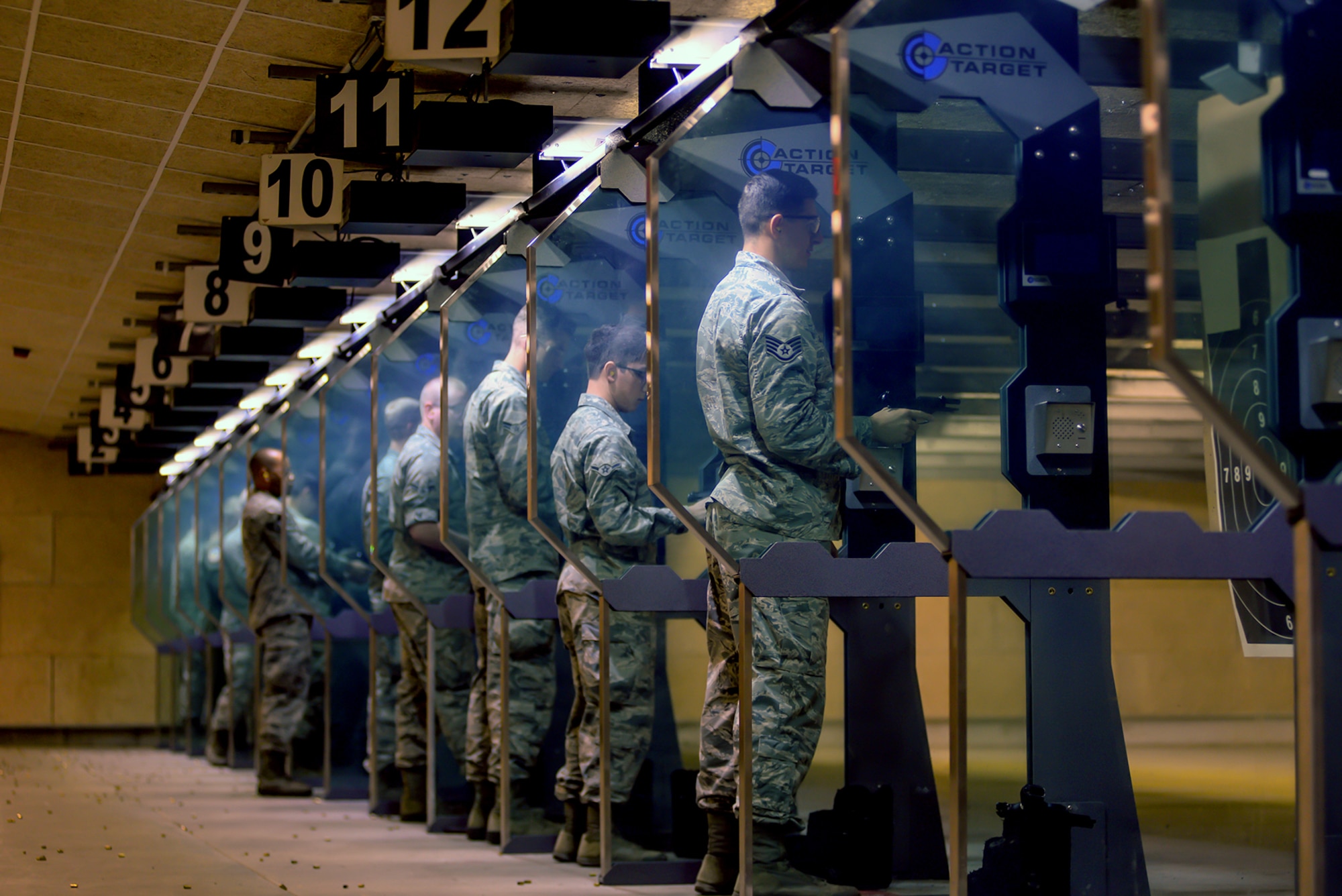 Participants in an Excellence in Competition pistol contest review their scores Aug. 30, 2018, at Offutt Air Force Base, Nebraska. Competitors who score in the top ten percent will have qualified to wear a badge in uniform distinguish themselves and excellent shots. (U.S. Air Force photo by Kendra Williams)