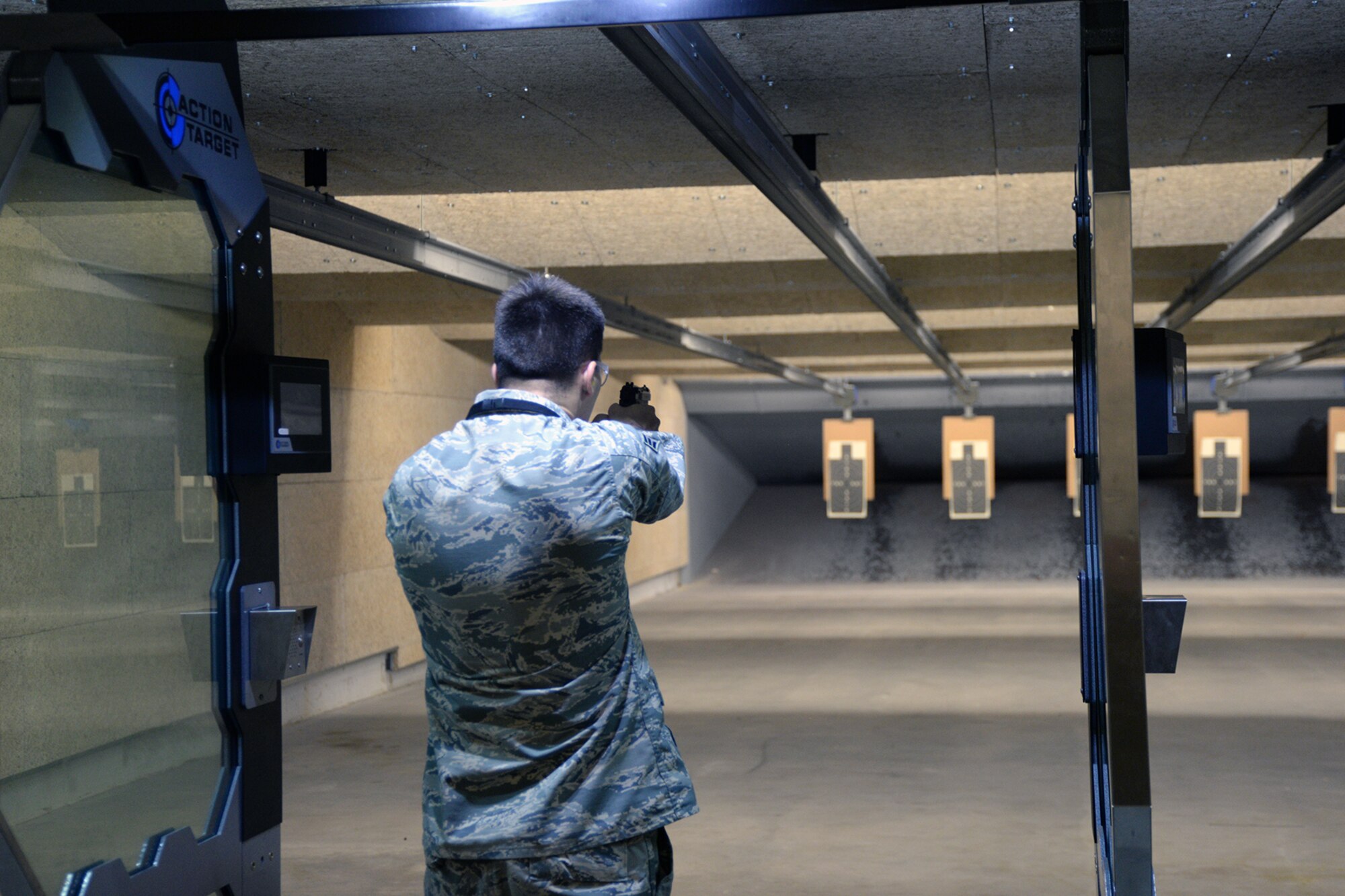 A participant in an Excellence in Competition pistol contest fires an M9 pistol Aug. 30, 2018, at Offutt Air Force Base, Nebraska. The 55th Security Forces Squadron’s Combat Arms unit organized the event which serves as a safe way for service members to compete in marksmanship among their peers. (U.S. Air Force photo by Kendra Williams)