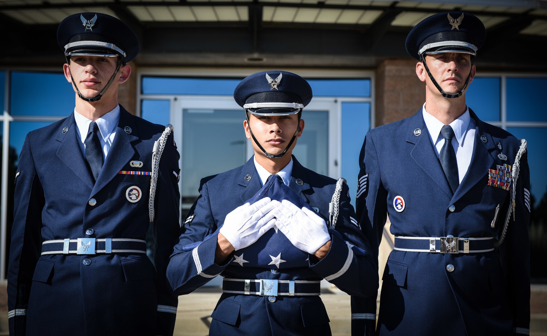 Buckley Air Force Base Mile High Honor Guardsmen prepare to raise the United States flag during a Patriot Day ceremony Sept. 11 2018, on Buckley AFB, Colorado. Team Buckley members held a ceremony in remembrance of the victims and families of those lost in New York, Pennsylvania and the Pentagon during the terrorist attacks on Sept. 11, 2001. (U.S. Air Force photo by Airman 1st Class Michael D. Mathews)