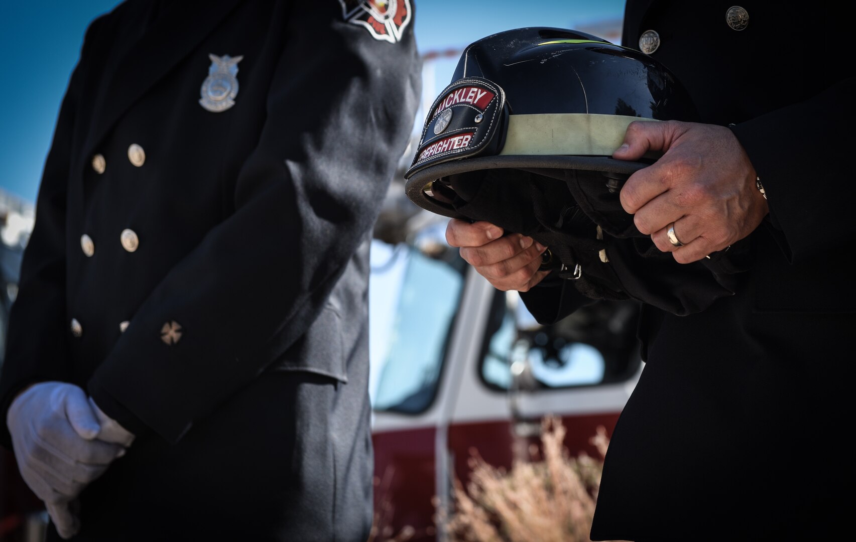 Firefighters assigned to the 460th Civil Engineer Squadron pay their respects to those who sacrificed their lives following the terrorist attacks of 9/11 during a Patriot Day ceremony Sept. 11 2018, on Buckley Air Force Base, Colorado. Team Buckley members held a ceremony in remembrance of the victims and families of those lost in New York, Pennsylvania and the Pentagon during the terrorist attacks on Sept. 11, 2001. (U.S. Air Force photo by Airman 1st Class Michael D. Mathews)