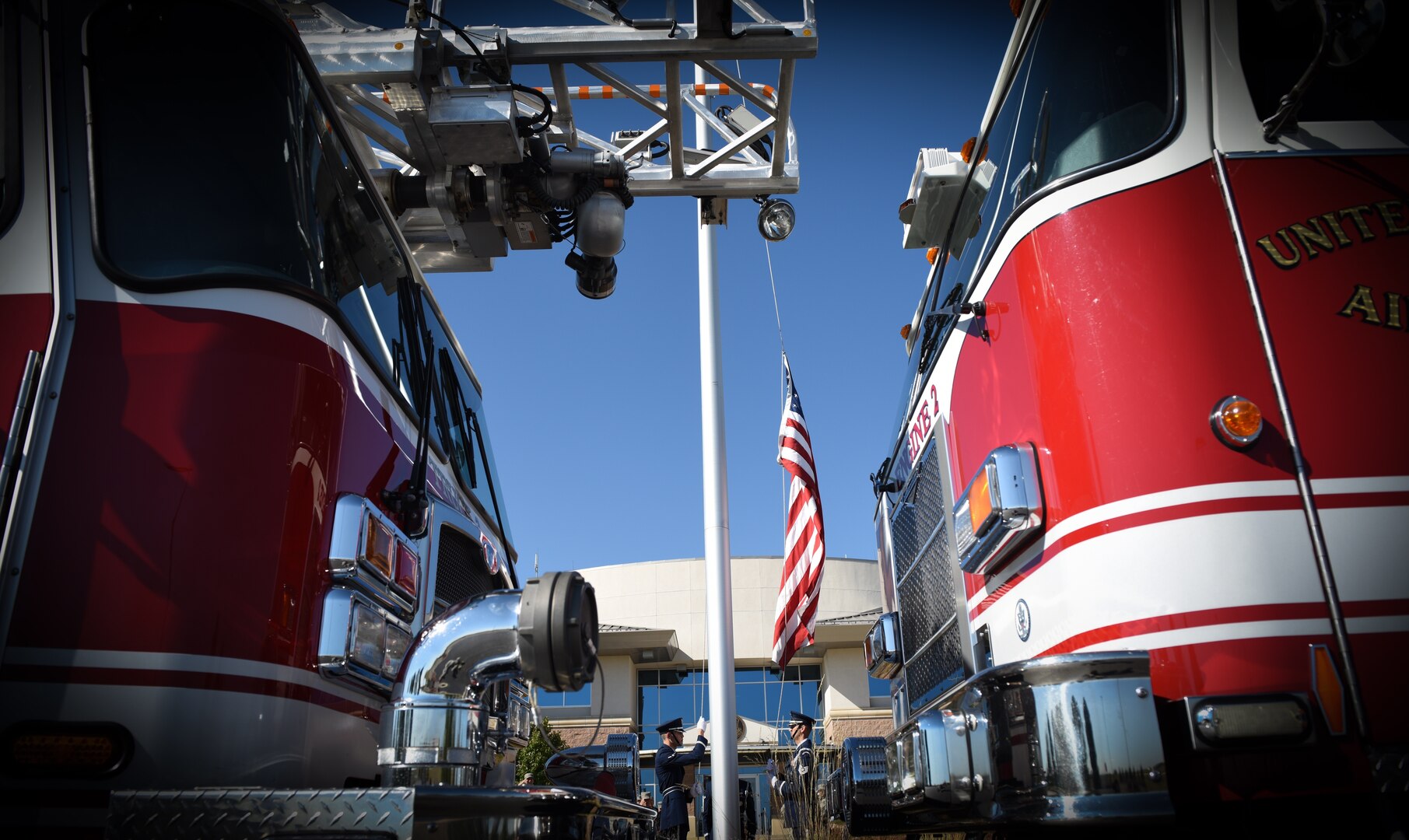 Buckley Air Force Base Mile High Honor Guardsmen raise the United States flag during a Patriot Day ceremony Sept. 11 2018, on Buckley AFB, Colorado. Team Buckley members held a ceremony in remembrance of the victims and families of those lost in New York, Pennsylvania and the Pentagon during the terrorist attacks on Sept. 11, 2001. (U.S. Air Force photo by Airman 1st Class Michael D. Mathews)