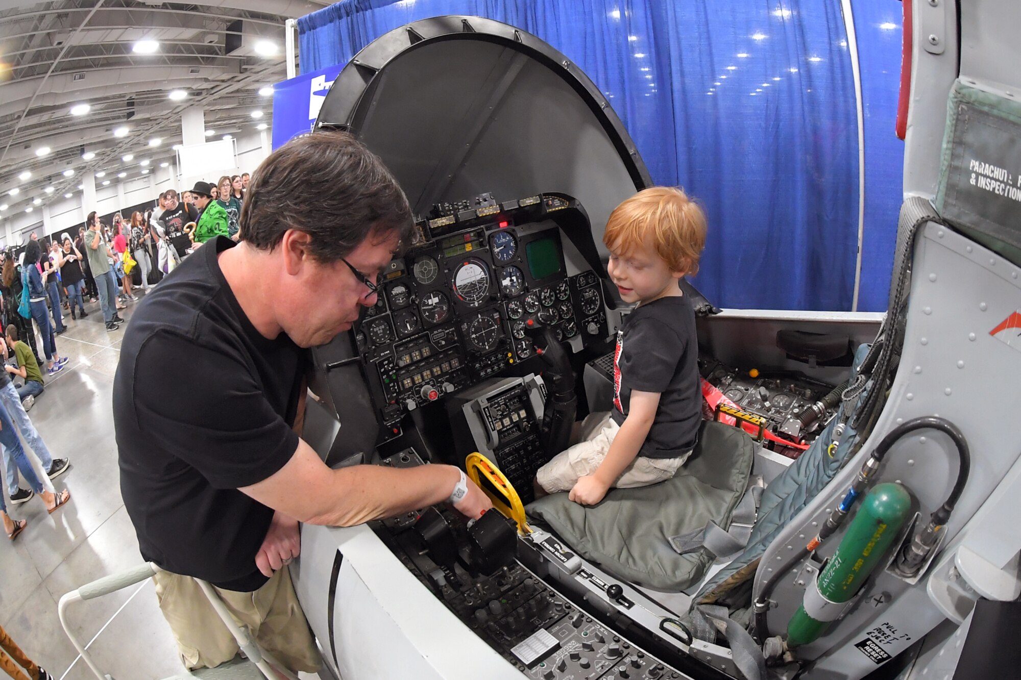 Visitors attending FanX experience an A-10 cockpit flight simulator at the Hill Air Force Base STEM Outreach booth, Sept. 7, Salt Lake City.