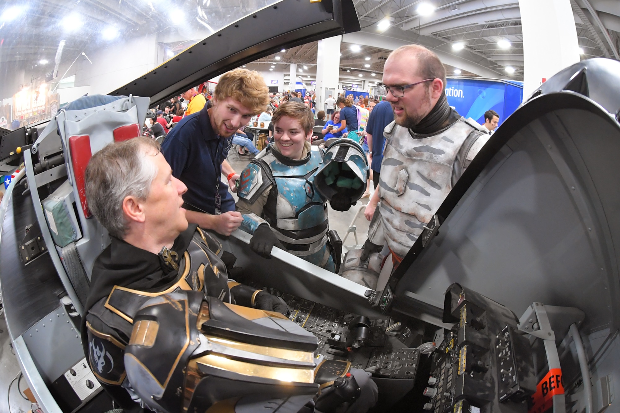FanX visitors dressed as Star Wars characters experience an A-10 cockpit flight simulator, while talking with Matt Kirk, 518th Software Maintenance Squadron, who was volunteering at the Hill Air Force Base STEM Outreach booth, Sept. 7, 2018, Salt Lake City.