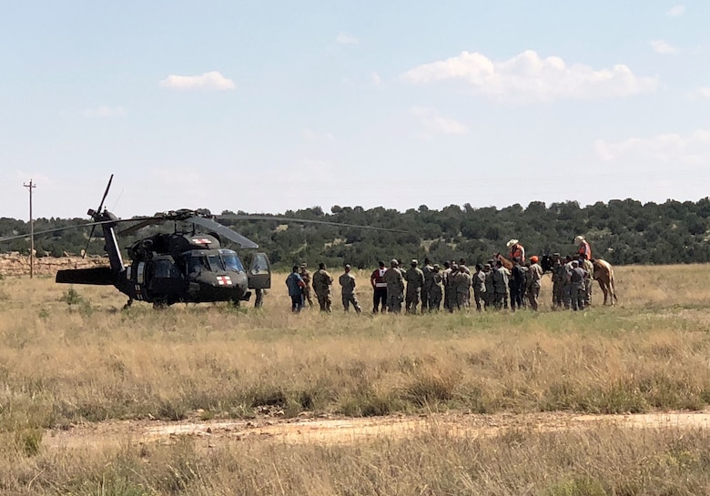 SANTA ROSA LAKE, N.M. -- Participants gather and discuss Operation Pave Hawk, Aug. 4, 2018.