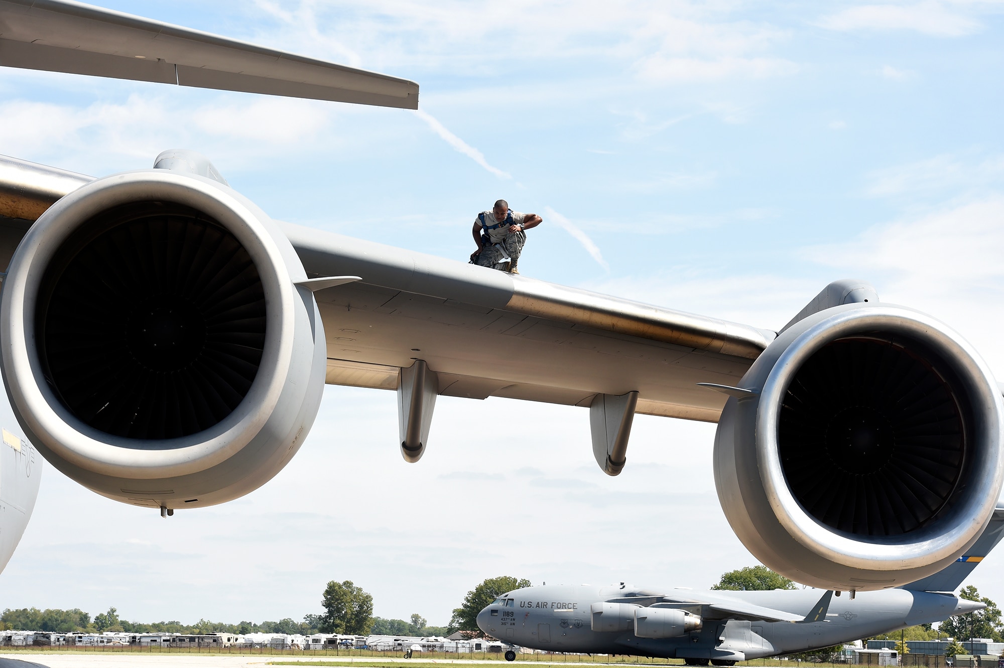 Airman 1st Class Quran Bullock, a 437th Aircraft Maintenance Squadron crew chief, performs post-flight inspections on top of a C-17 Globemaster III Sept. 12, 2018, at Scott Air Force Base, Ill.