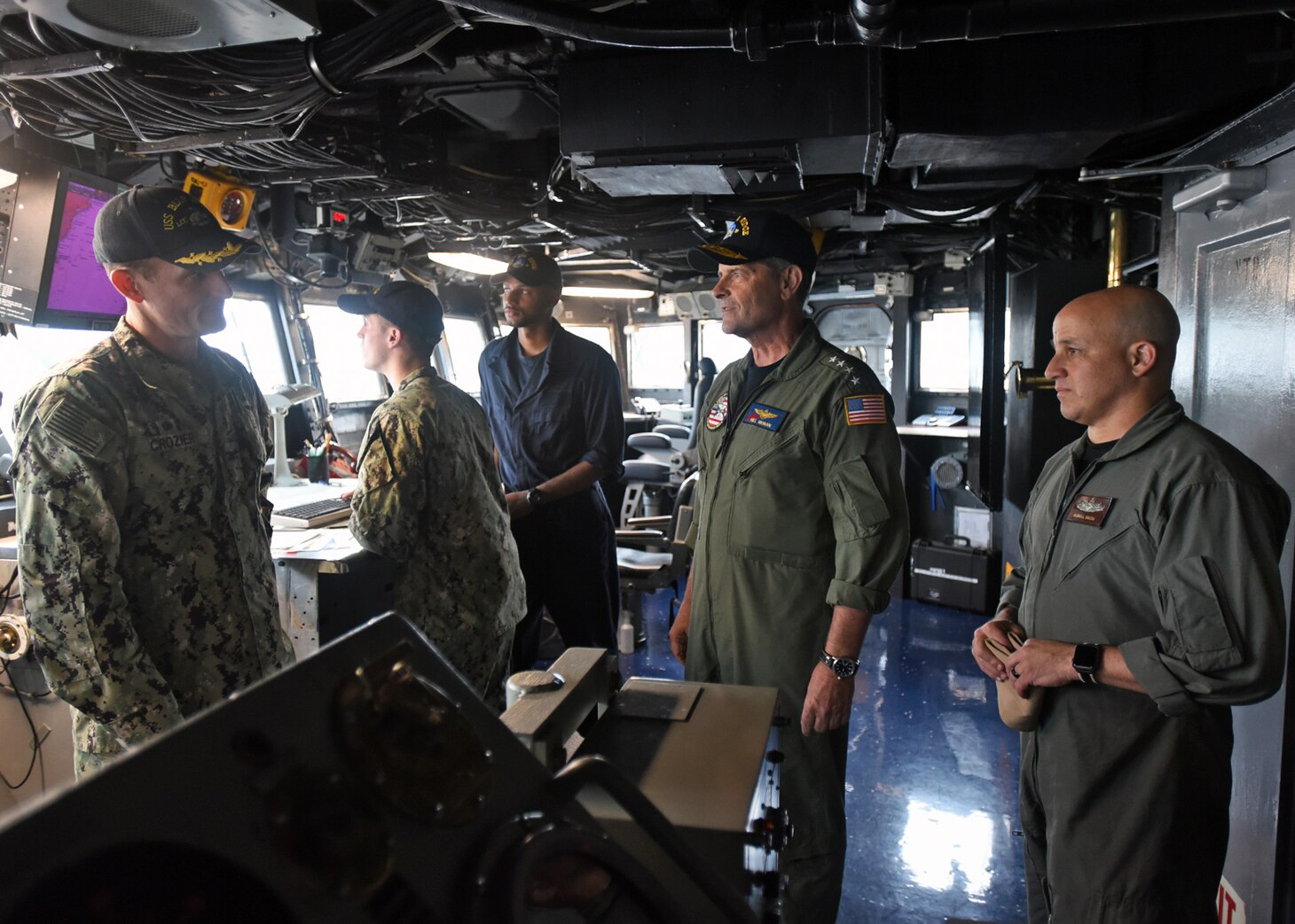 180912-N-YG414-086 The Commanding Officer of the U.S. 7th Fleet Flagship USS Blue Ridge (LCC 19) Capt. Brett E. Crozier speaks with the Vice Chief of Naval Operations Bill Moran and Master Chief Petty Officer of the Navy Russell Smith during a ship tour. Blue Ridge is in a final upkeep and training phase in preparation to become fully mission capable for operations.