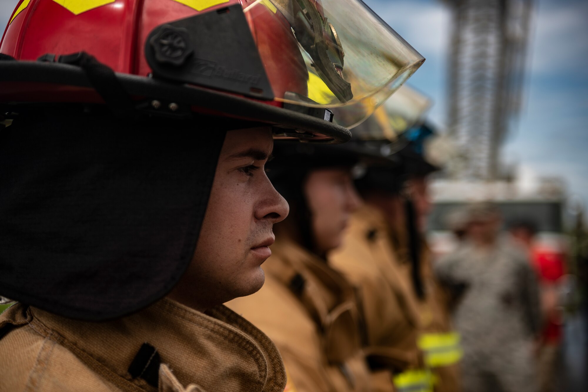 Firefighters from the 18th Civil Engineer Squadron stand at ease before the Kadena Fire Emergency Services 9/11 Memorial Stair Climb Sept. 11, 2018, at Kadena Air Base, Japan. The event was held to honor the sacrifices 417 first responders made during the Sept. 11, 2001, terrorist attacks at the World Trade Center in N.Y. (U.S. Air Force photo by Staff Sgt. Micaiah Anthony)
