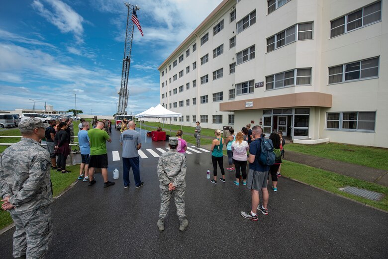 U.S. Air Force Lt. Col. Tara Opielowski, 18th Security Forces Squadron commander, gives opening remarks during the Kadena Fire Emergency Services 9/11 Memorial Stair Climb Sept. 11, 2018, at Kadena Air Base, Japan. The event was open to all personnel with base access to honor the sacrifice first responders made during the Sept. 11, 2001, terrorist attacks and remember the victims of that day. (U.S. Air Force photo by Staff Sgt. Micaiah Anthony)