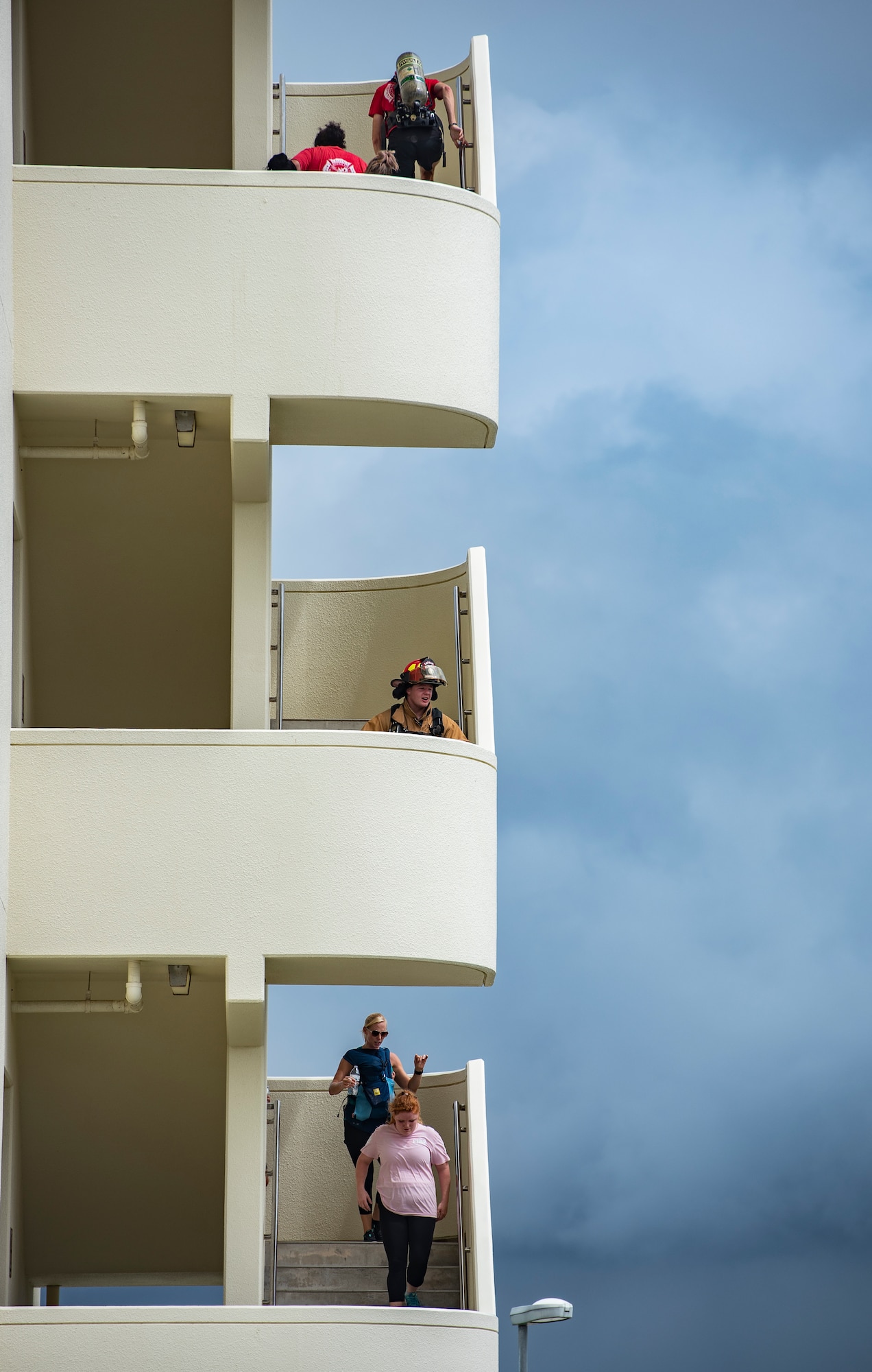 Participants of the Kadena Fire Emergency Services 9/11 Memorial Stair Climb walk up and down a flight of stairs Sept. 11, 2018, at Kadena Air Base, Japan. Participants climbed a total of 110 flights of stairs to honor the sacrifice first responders made during the Sept. 11, 2001, terrorist attacks at the World Trade Center in N.Y. (U.S. Air Force photo by Staff Sgt. Micaiah Anthony)