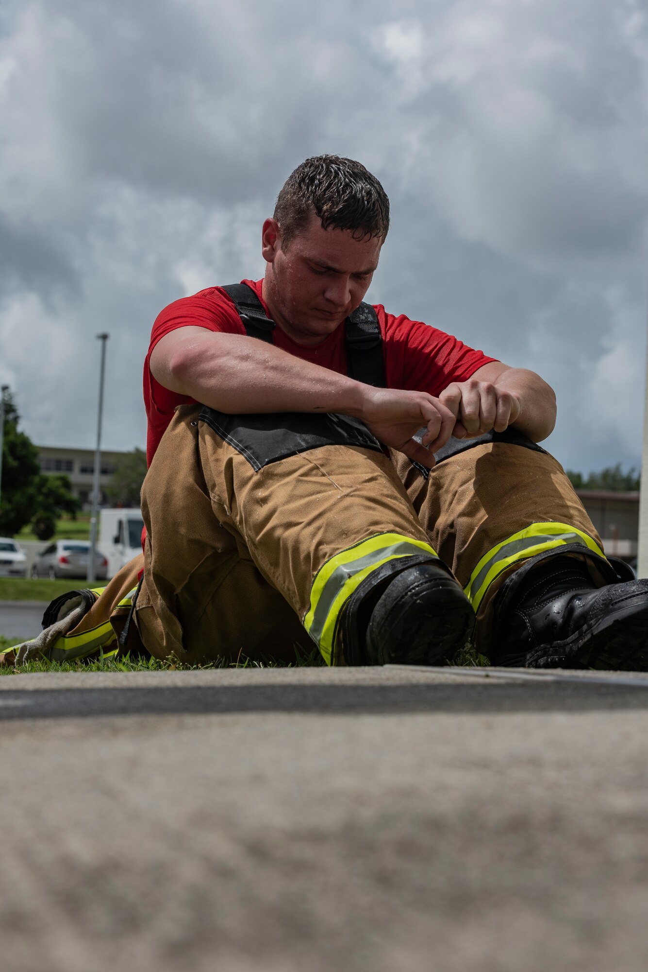 U.S. Air Force Senior Airman Forrest Privette, 18th Civil Engineer Squadron driver operator, takes a moment to reflect after climbing 110 flights of stairs during the Kadena Fire Emergency Services 9/11 Memorial Stair Climb Sept. 11, 2018, at Kadena Air Base, Japan. The event was held to honor the sacrifices 417 first responders made during the Sept. 11, 2001, terrorist attacks at the World Trade Center in N.Y. (U.S. Air Force photo by Staff Sgt. Micaiah Anthony)