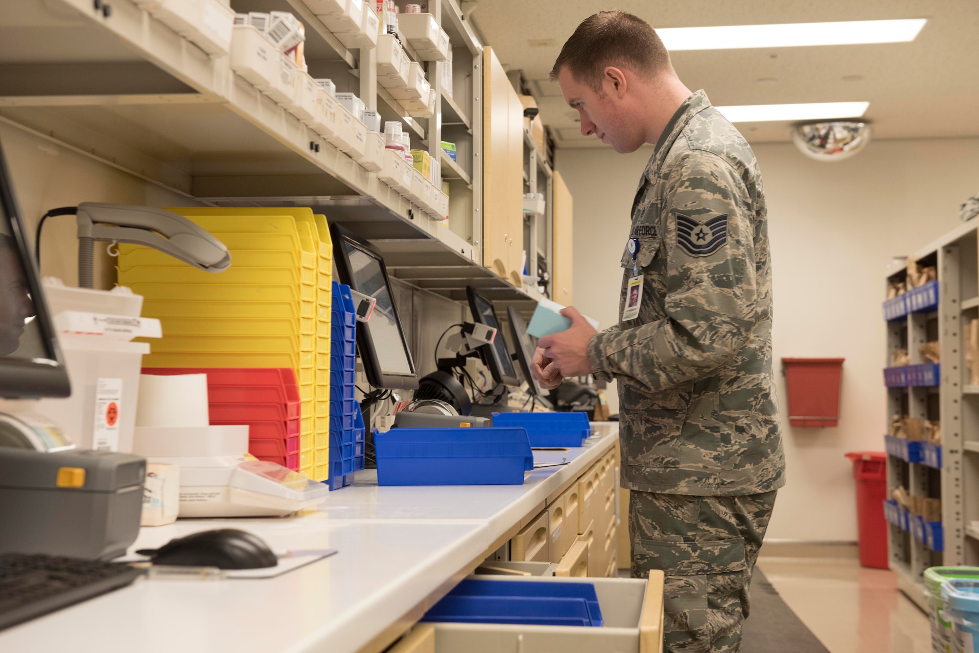 U.S. Air Force Tech. Sgt. Ryan Marr, 18th Medical Group pharmacy NCOIC, checks a prescription Sept. 10, 2018, at Kadena Air Base, Japan. The pharmacy technicians service members and their families from all across Okinawa.
