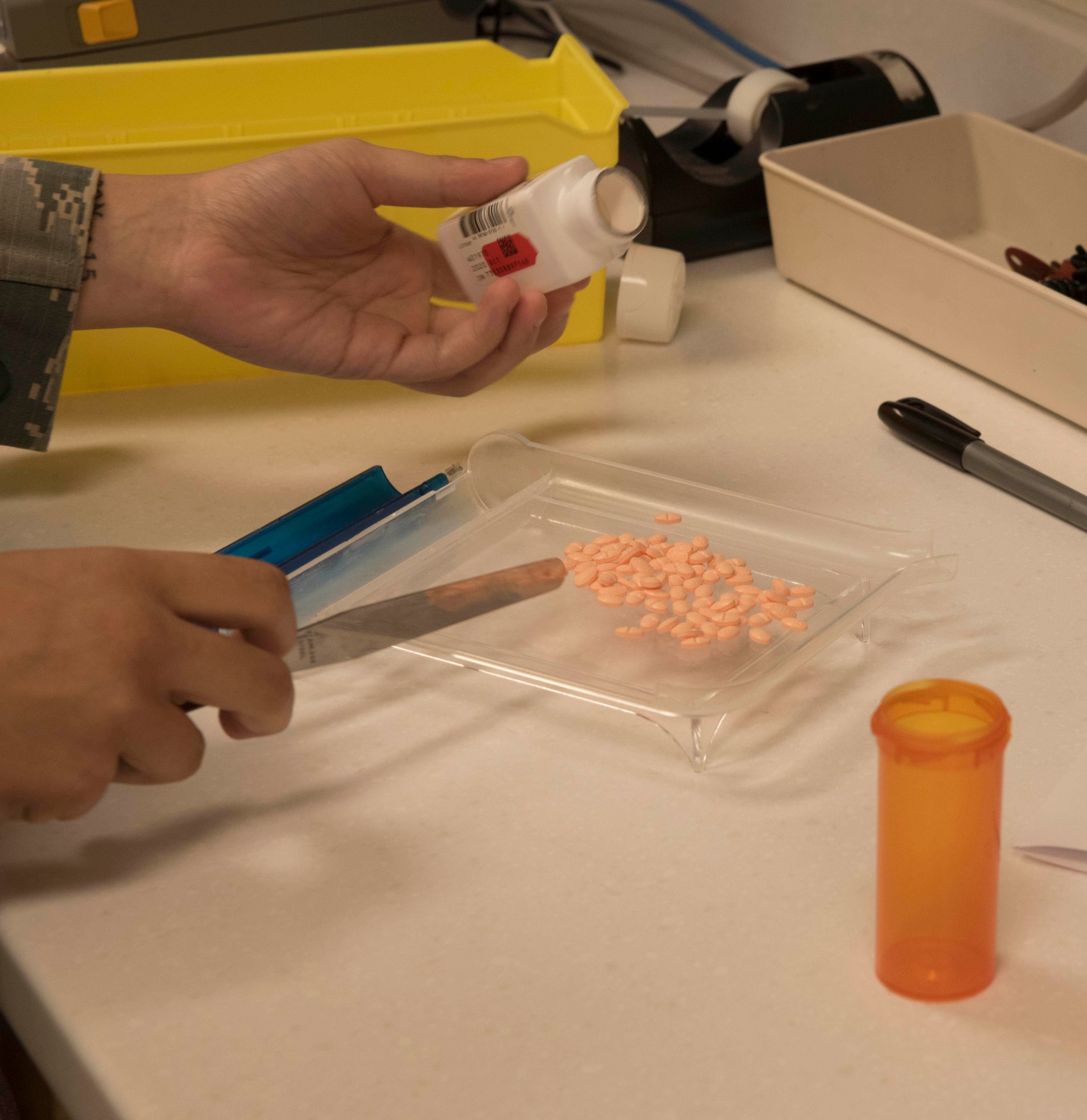 U.S. Air Force Senior Airman Cheyenne Wright, 18th Medical Group pharmacy technician, counts medication Sept. 10, 2018, at Kadena Air Base, Japan. Technicians ensure patients receive the appropriate number of the correct tablets as determined by their medical providers.