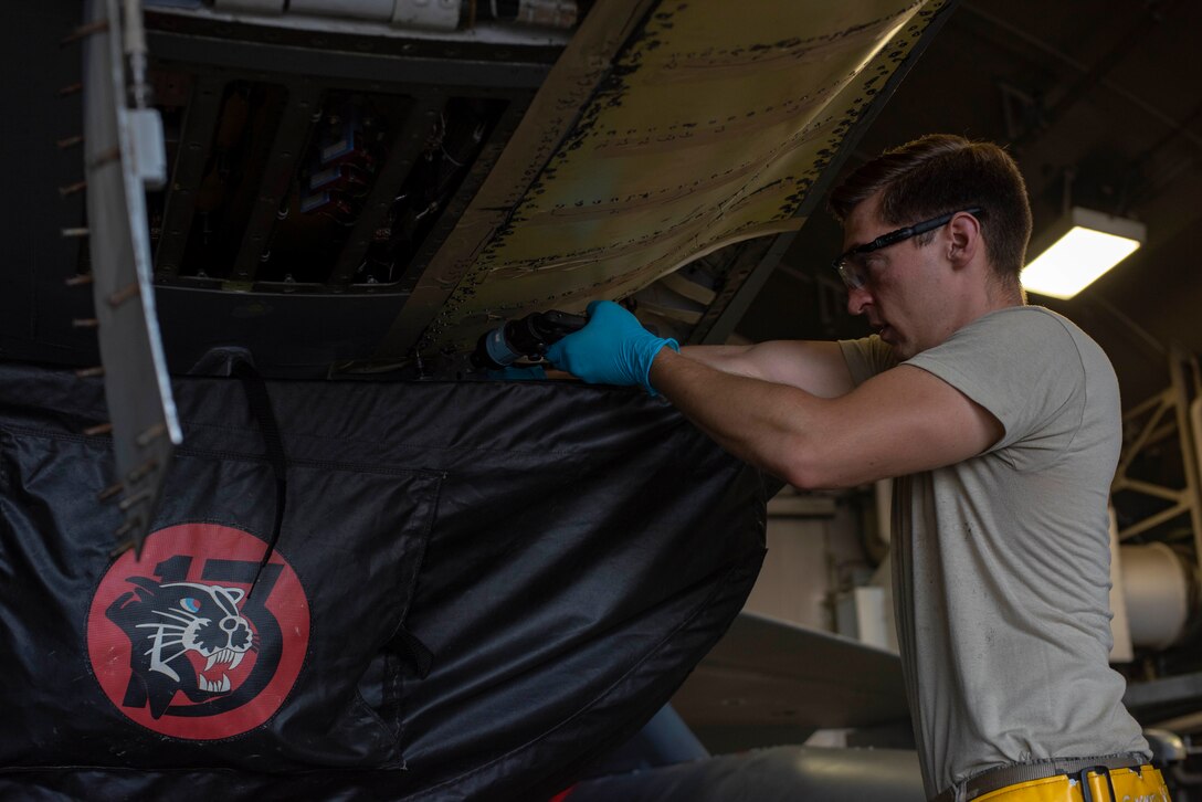 U.S. Air Force Staff Sgt. Charles White, a 35th Maintenance Squadron sheet metal shop aircraft structural maintenance craftsman, maintains an F-16 Fighting Falcon at Misawa Air Base, Japan, Aug. 24, 2018. In one month’s time, the three-man team removed seven major construction components, three skins, two ribs and cut out a total longeron which maintains the structural rigidity of the airframe. (U.S. Air Force photo by Airman 1st Class Collette Brooks)