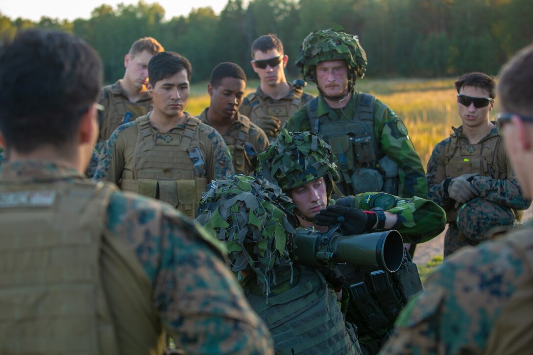 Swedish Marines of 1st Marine Regiment demonstrate U.S. Marines with Marine Rotational Force-Europe 18.1 how to fire the Carl Gustaf anti-tank recoilless rifle during Exercise Archipelago Endeavor aboard the island of Uto, Sweden, Sept. 6, 2018. Exercise Archipelago Endeavor is an integrated field training exercise that increases operational capability and enhances strategic cooperation between the U.S. Marines and Swedish forces. (U.S. Marine Corps photo by Lance Cpl. Menelik Collins /Released)